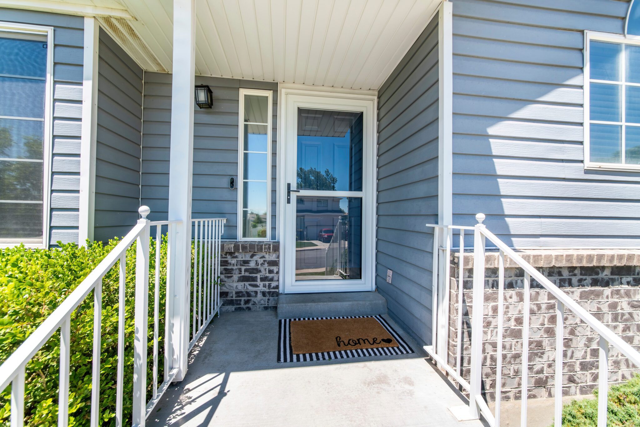 White storm door glass on entry from exterior