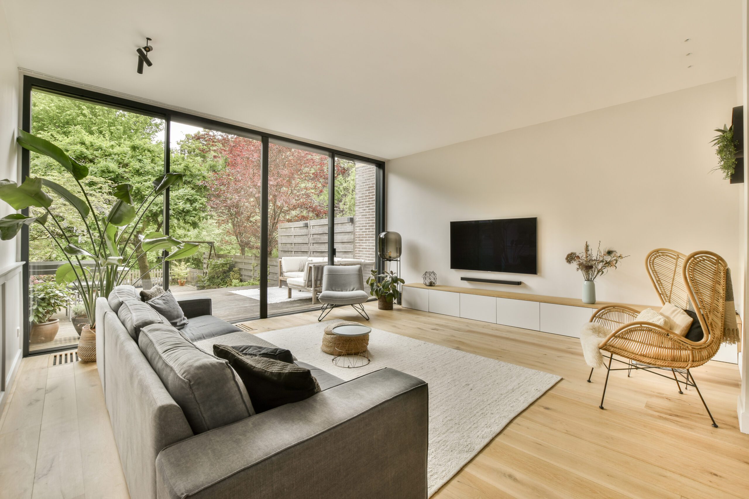 Interior view of a modern living room equipped with large sliding glass doors